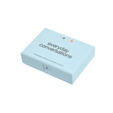 A light blue rectangular box labeled 'everyday conversations' with small colored dots above the text, photographed on a clean off-white background.