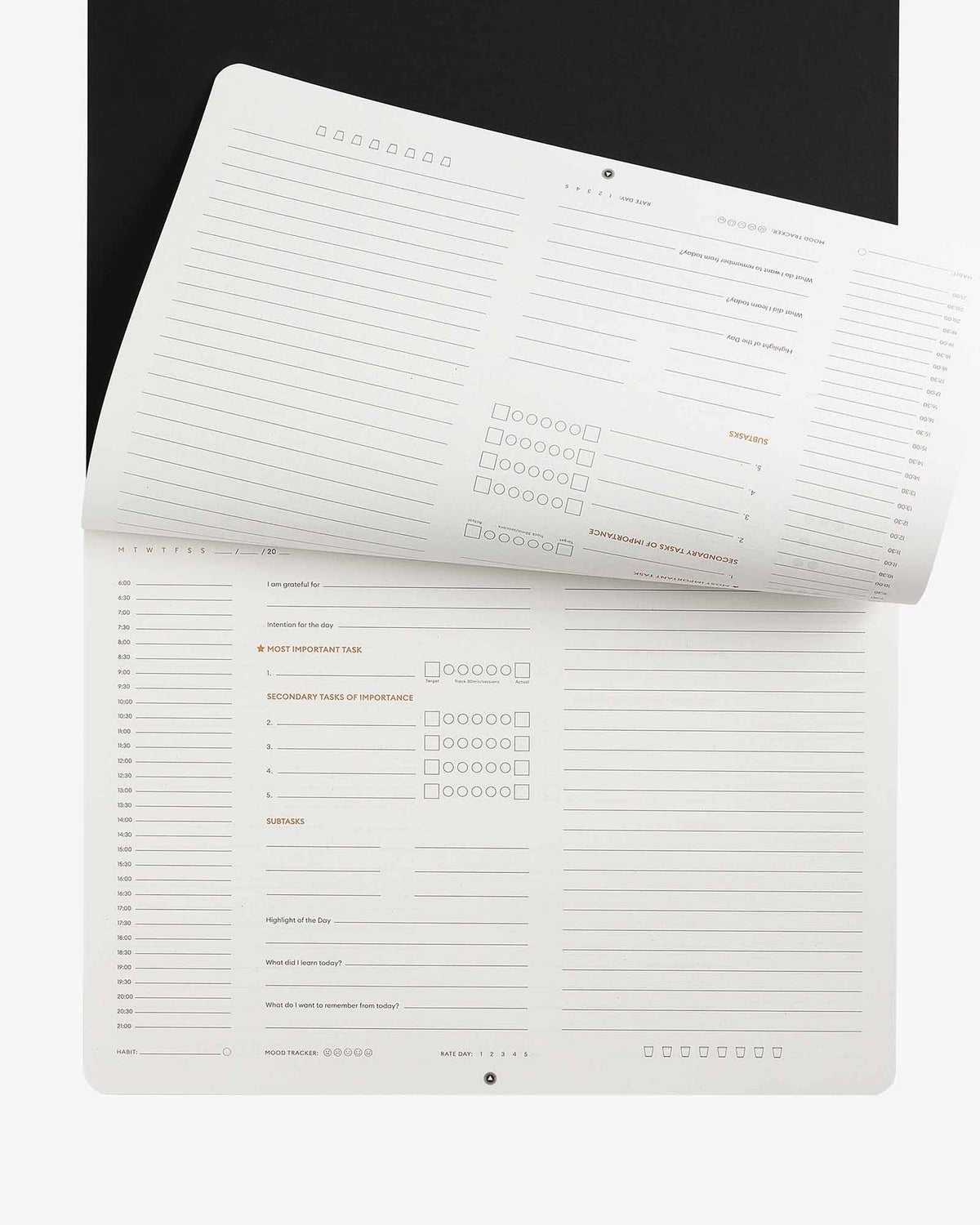 Productivity desk pad with its pages fanned open