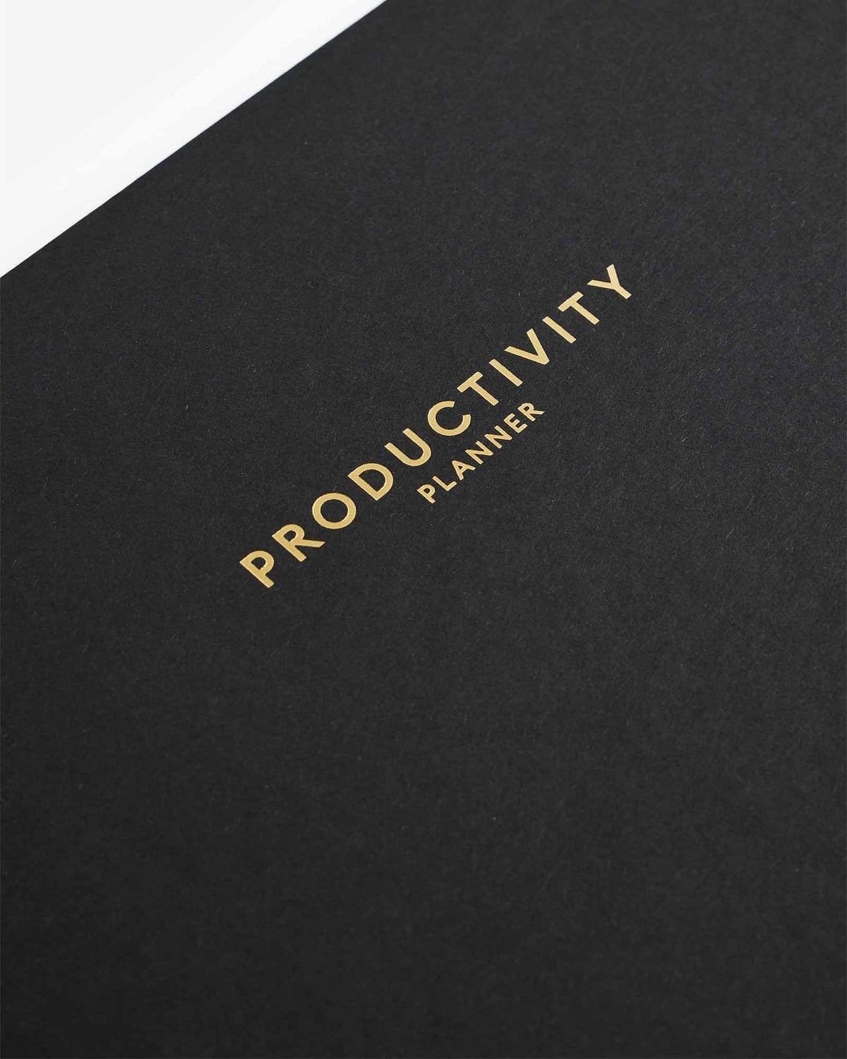 Close view of the gold Productivity lettering on the black cover