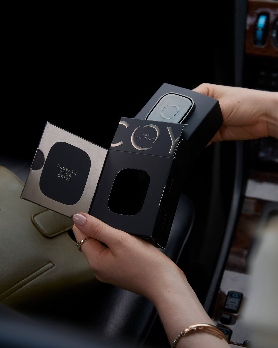 Ecoya Car Diffuser being fitted with its Lotus Flower fragrance pod