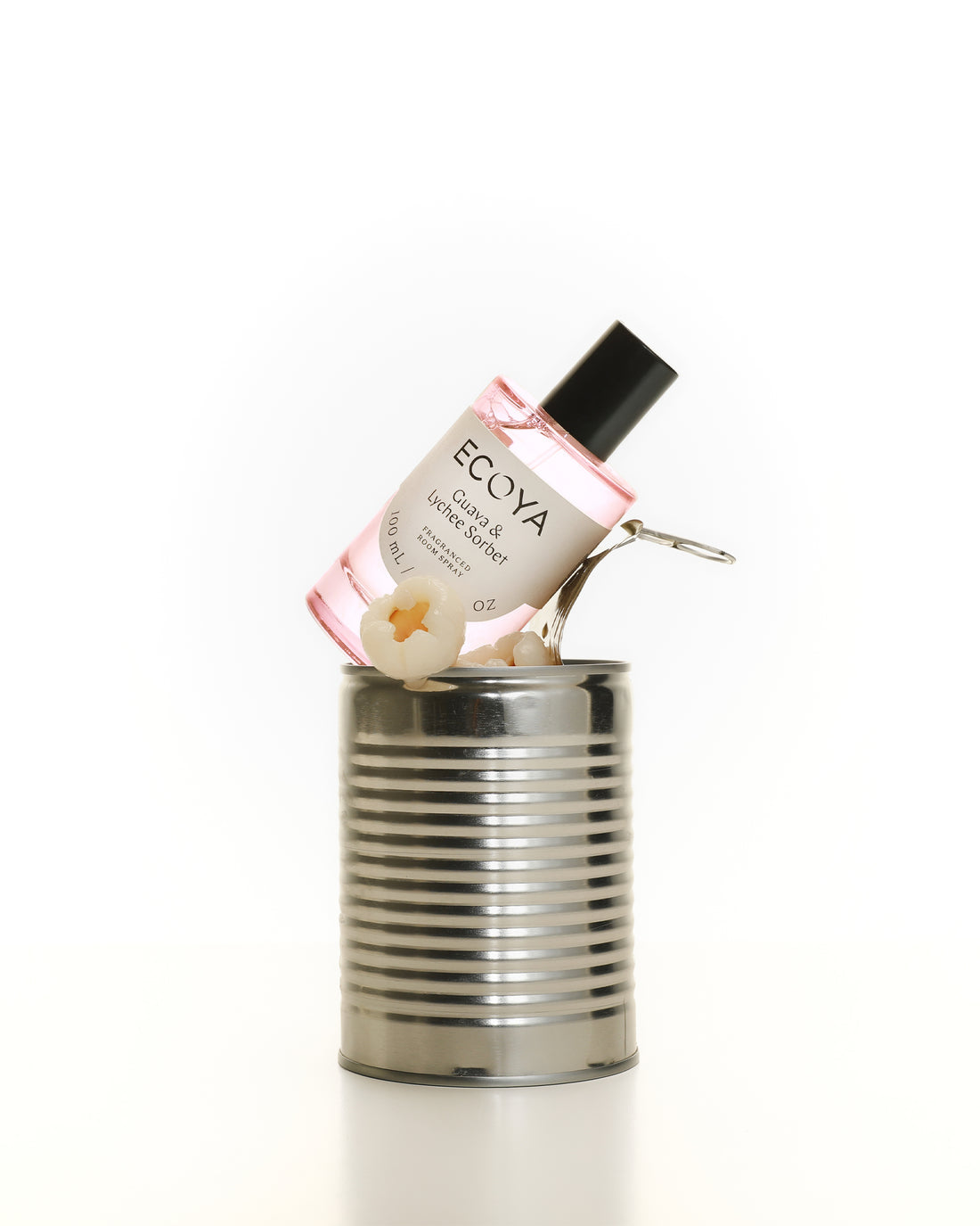 Pink Ecoya room spray tipped playfully inside an open tin can