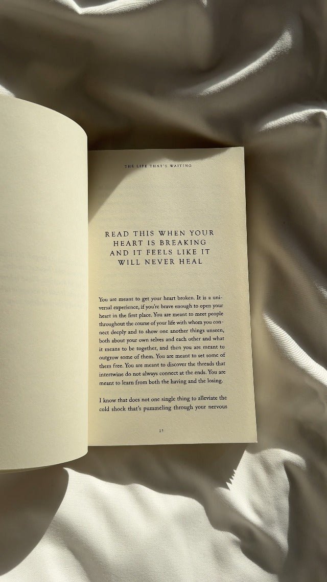 The Life That's Waiting open to a chapter on heartbreak, on rumpled cream bedding