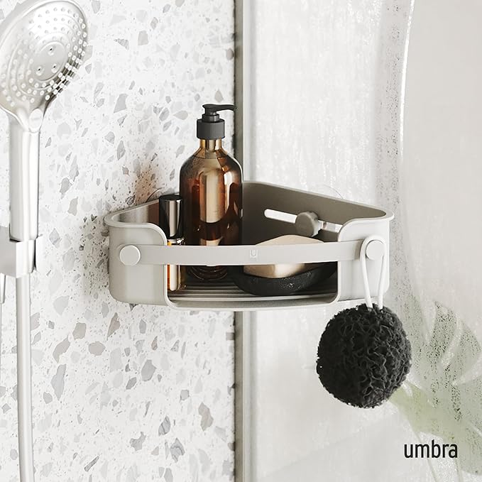 Umbra Flex corner bin in grey with a soap pump and dish, sponge hanging from the knob