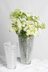 Faceted cut glass vase, large and small sizes shown together