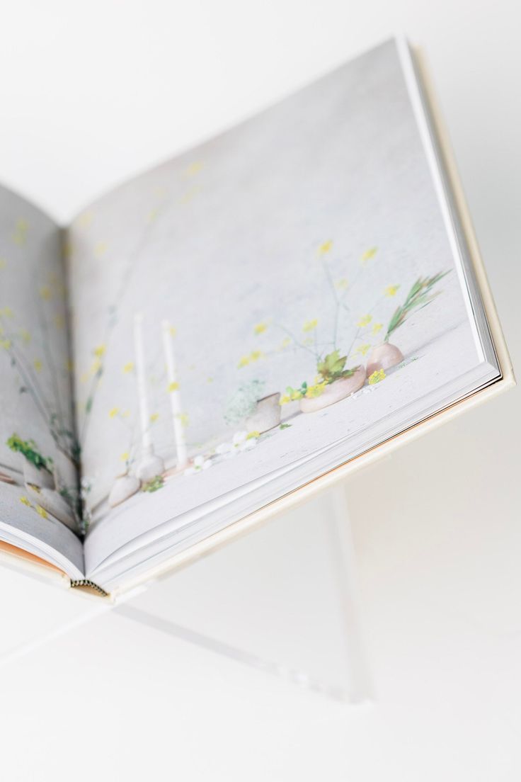 Acrylic X-frame book holder shown from the side