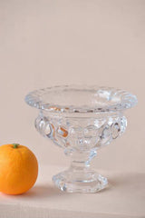 Louisa footed glass pedestal bowl small size shown with an orange for scale