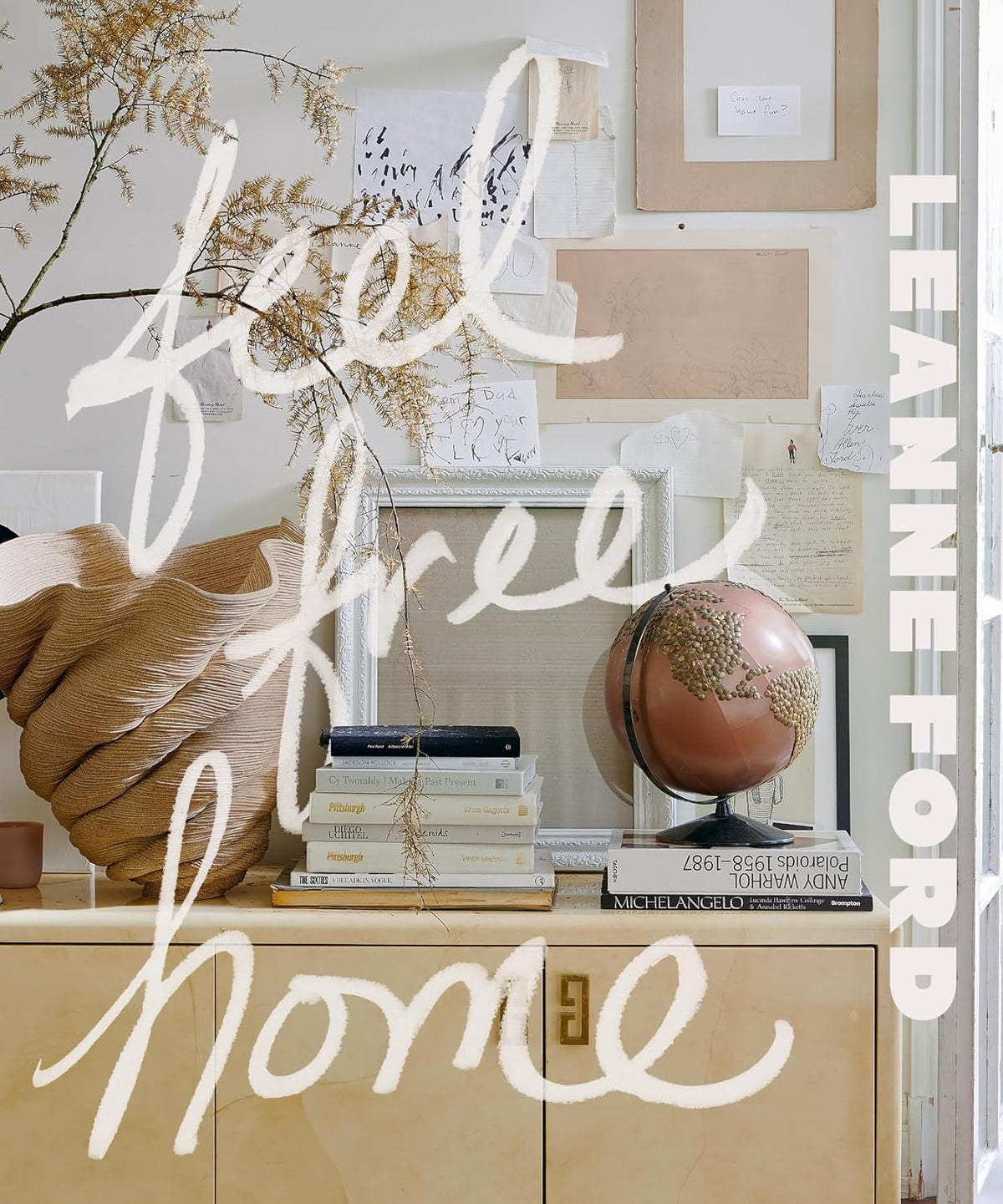 Feel Free Home by Leanne Ford, handwritten cover title over a styled shelf with a globe