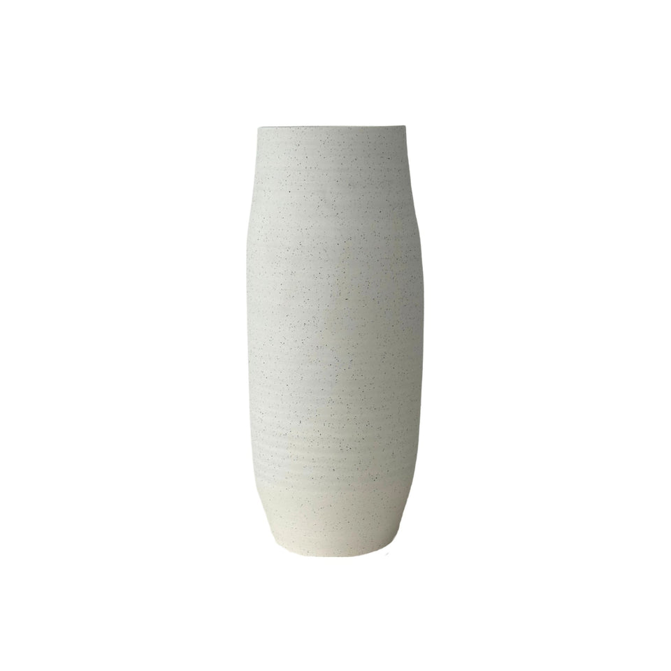 Ash textured ceramic vase in beige styled on a console