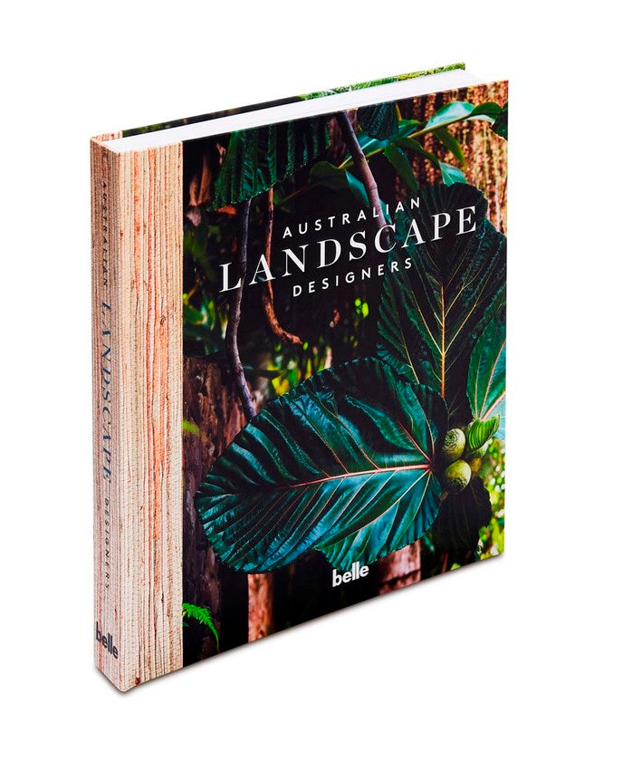 Australian Landscape Designers hardback shown at an angle, cover photograph of deep green foliage