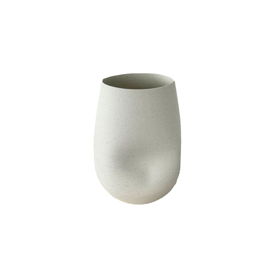 Hazel formation ceramic vase in beige styled on a console