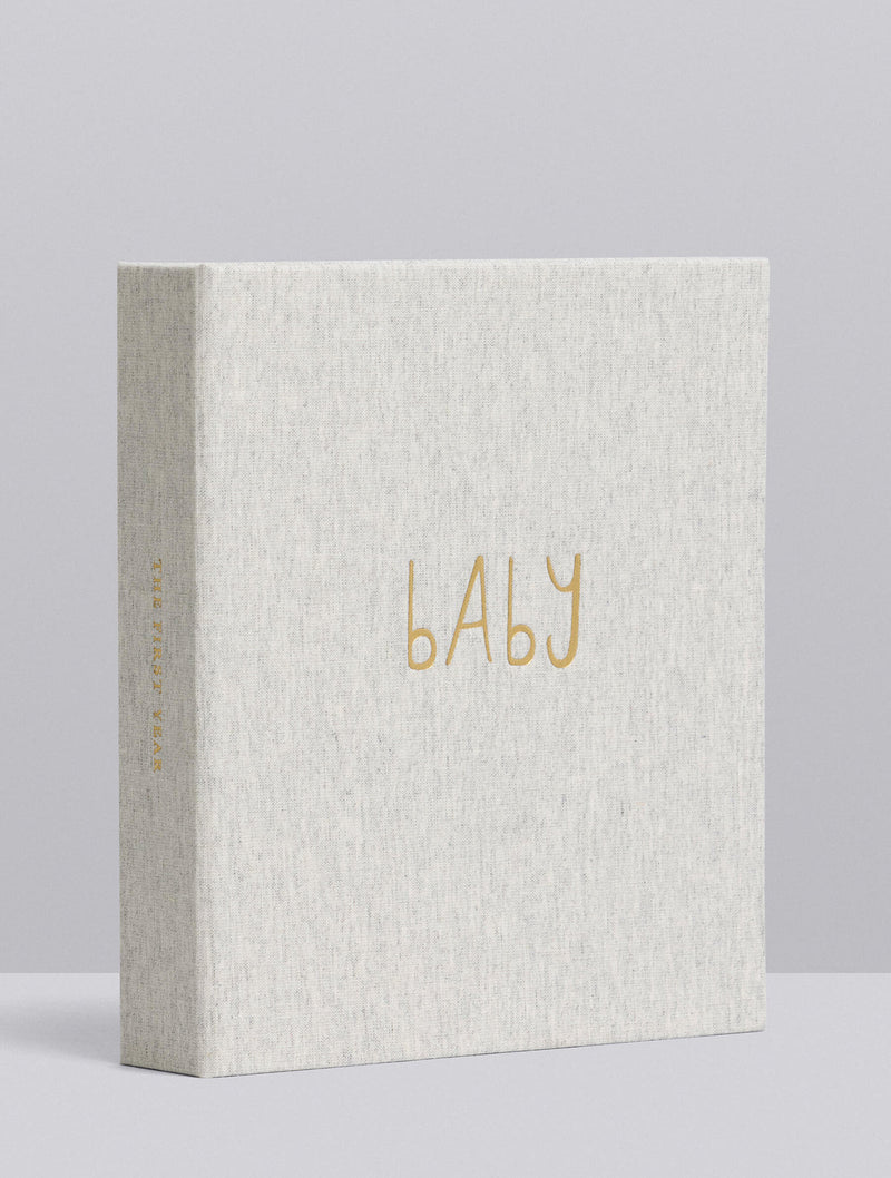 Light grey baby journal album with 'BABY' text in gold on a light gray background
