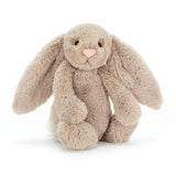 A soft plush Jellycat Bashful Beige Bunny sitting on a white background.