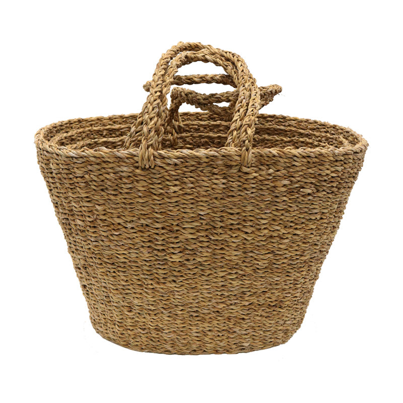 Front view of the seagrass basket, tapered oval body with twin rope handles