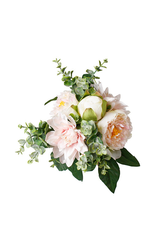 Faux dahlia and peony bouquet in blush pink and cream with green foliage on a white background