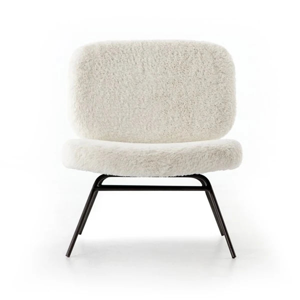 Crescent chair face on, the rounded back floating above the seat on splayed legs