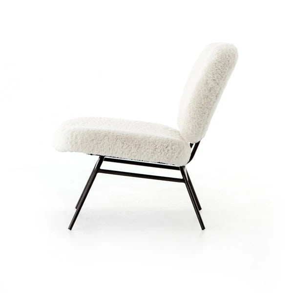Side profile of the Crescent chair, the back angled over the black wire frame