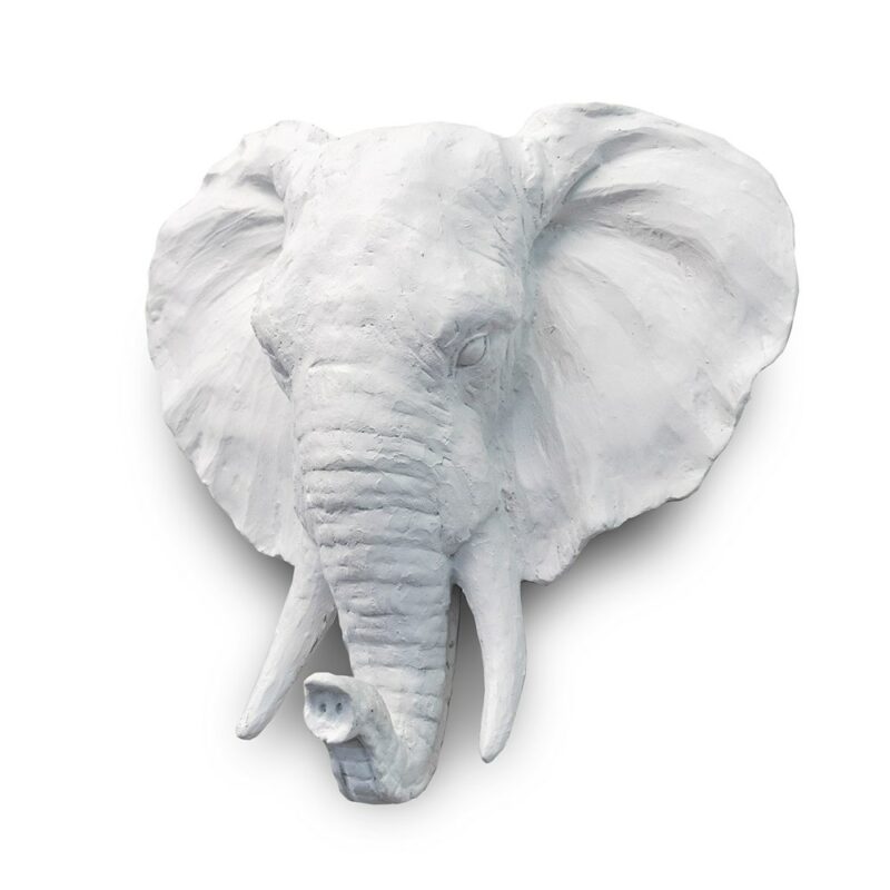 White elephant plaque turned to a three quarter angle, trunk and tusks in profile