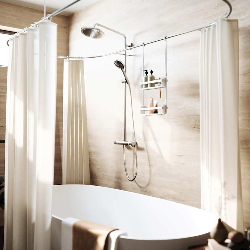 A bathroom with a bathtub and shower curtain decorated with the Umbra FLEX SHOWER CADDY - Black / White.