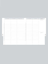 A white 2024 DAILY HUSTLE PLANNER in oatmeal by Write To Me for monthly scheduling on a gray background.