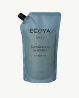 Ecoya Sandalwood and Amber shampoo 1L refill pouch with a black screw cap