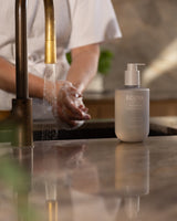 Ecoya Tahitian Lime and Grapefruit hand wash styled beside a kitchen sink