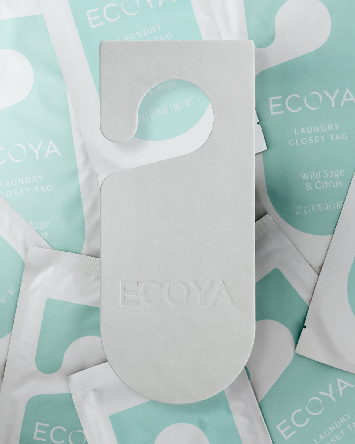 Ecoya closet tag detail showing the fragrance card and cord