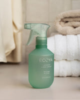 Ecoya Wild Sage and Citrus linen spray styled on a made bed