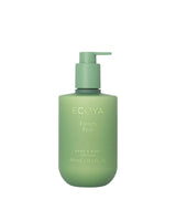 Green bottle of Ecoya French Pear hand and body lotion on a white background