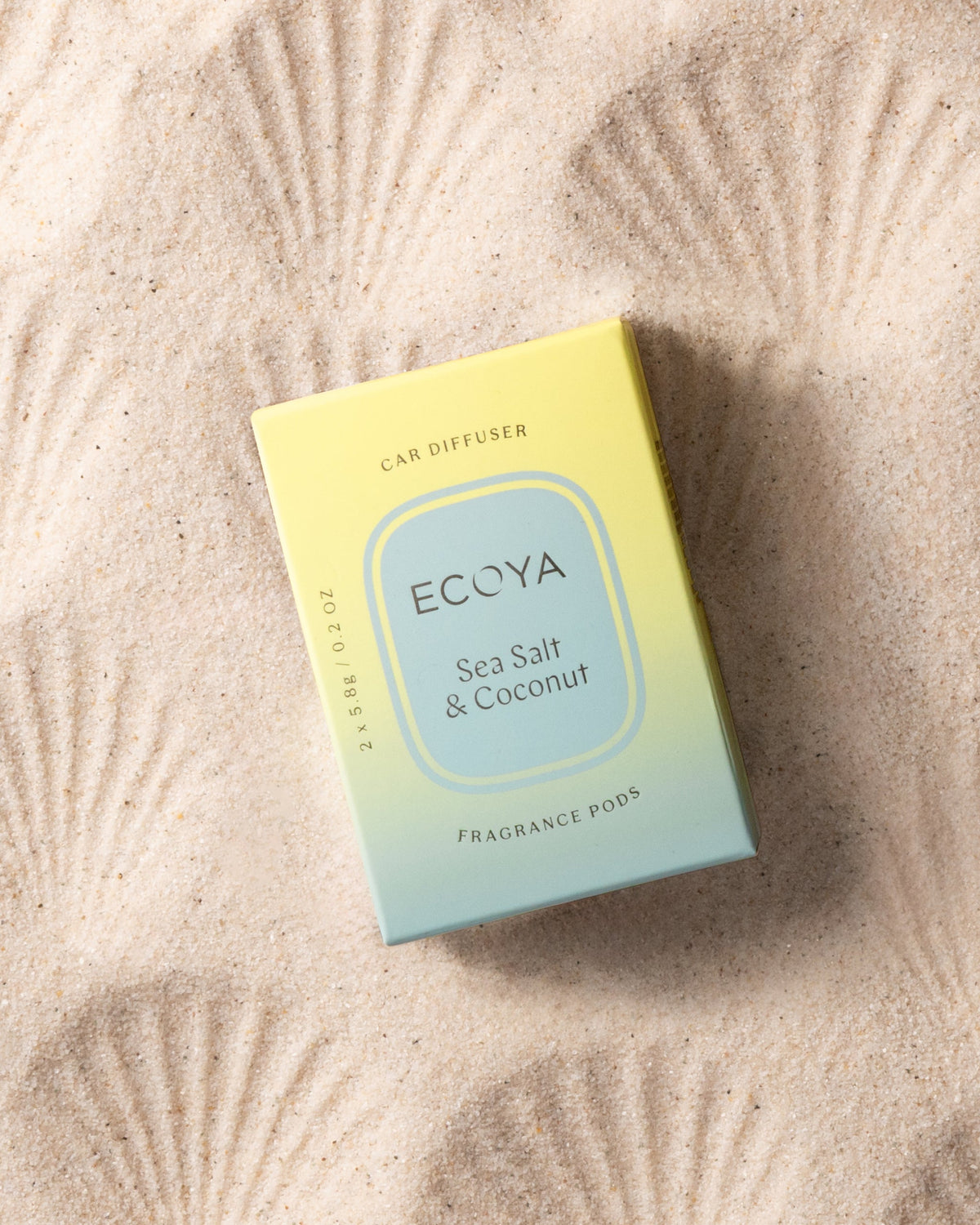 Ecoya Sea Salt and Coconut car diffuser pods shown with the car diffuser unit