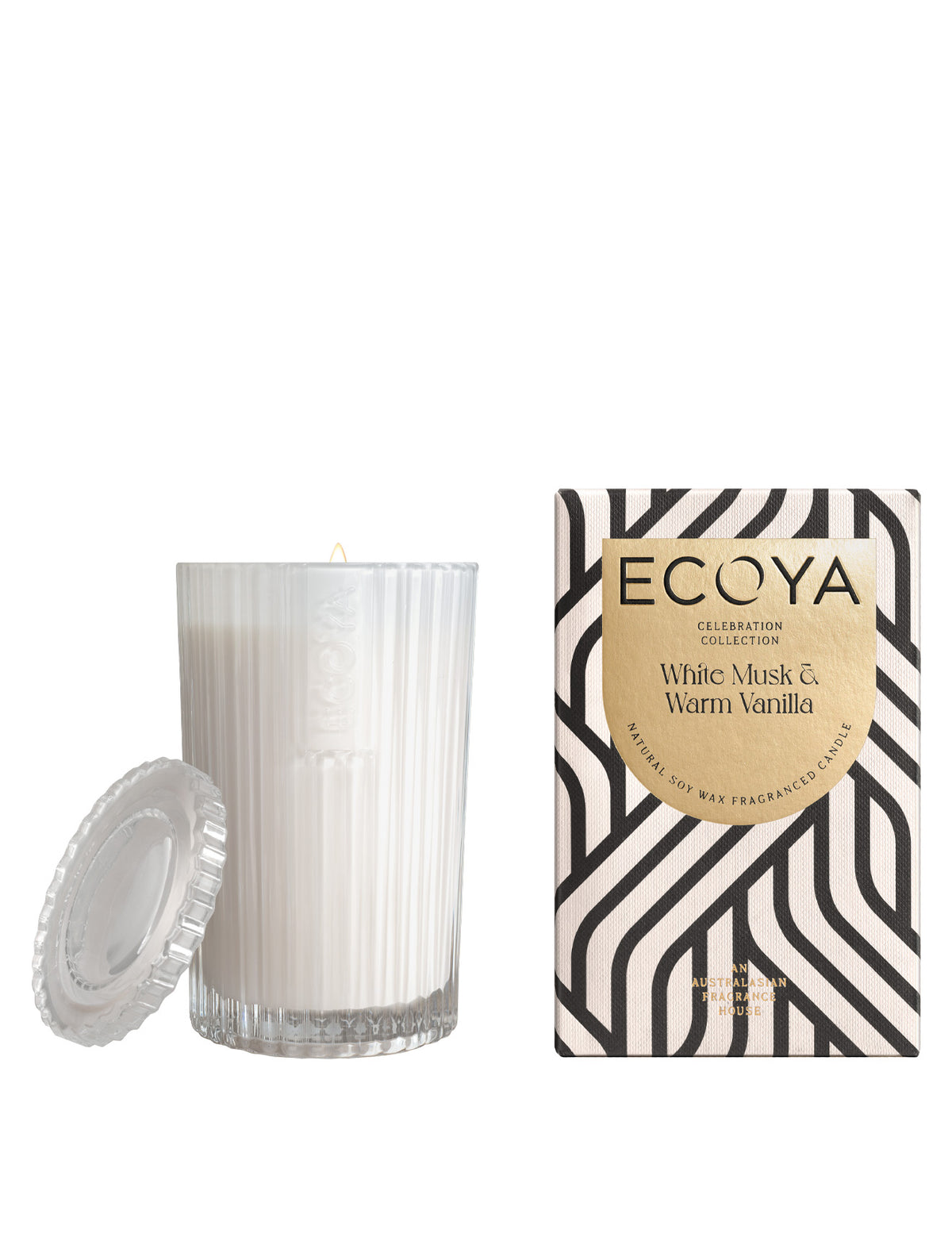 Ecoya Celebration candle in its white cut glass jar beside its patterned box