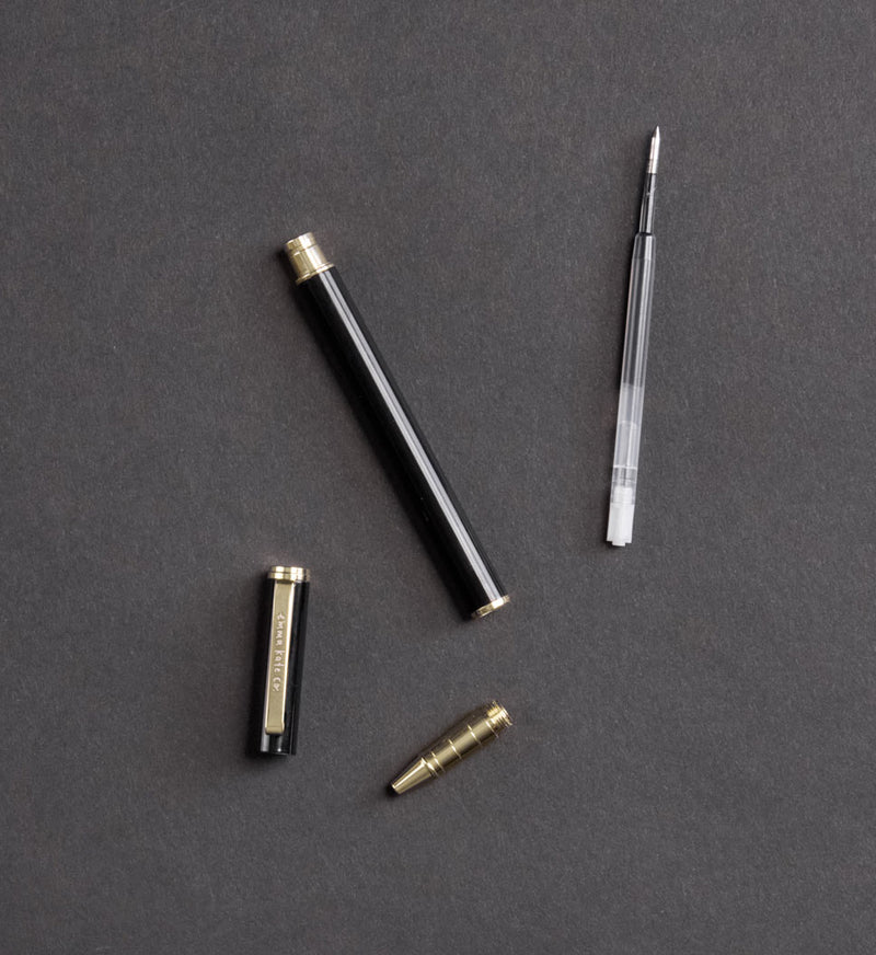 Emma Kate Co Pen Refill Cartridges styled on desk with rollerball pen