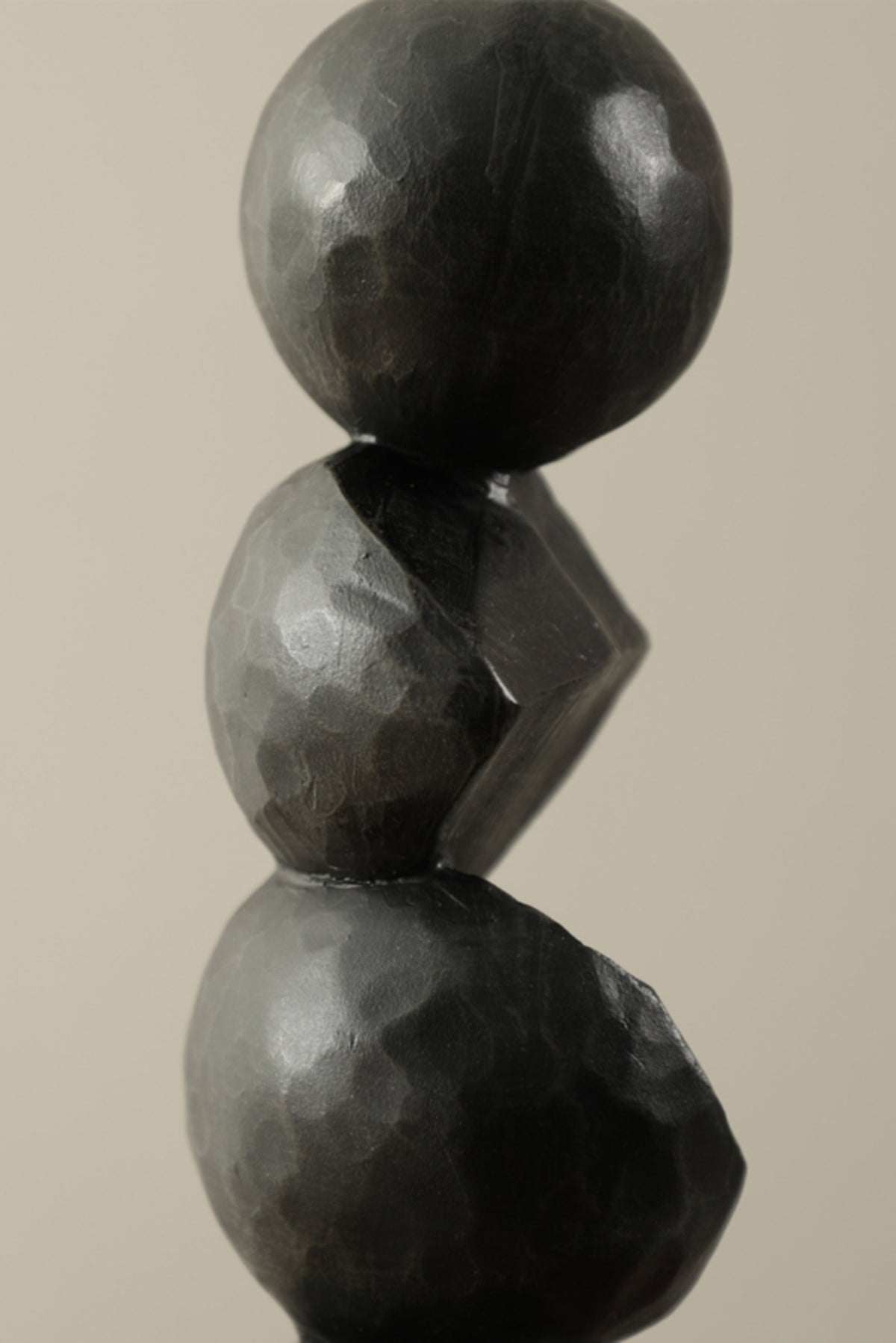 Black stacked resin pillar sculpture, close view