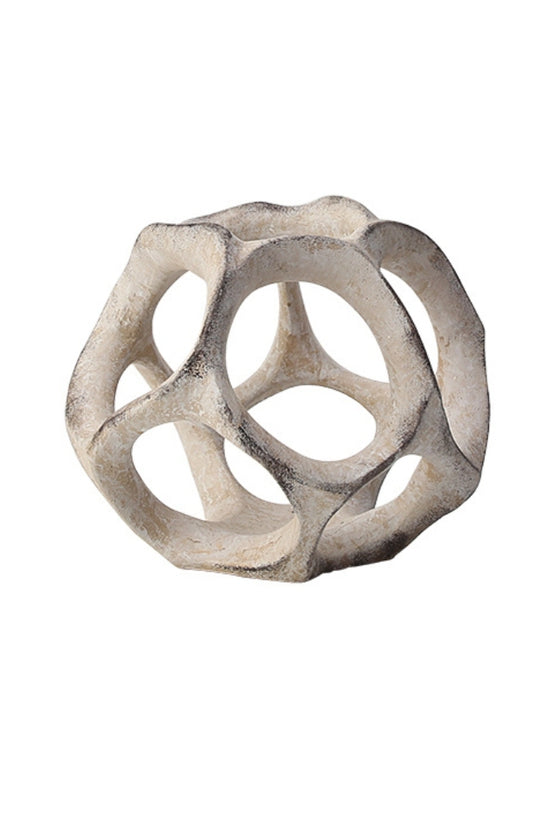 Cosmo resin sphere in off-white with open cut-out panels, on a plain background