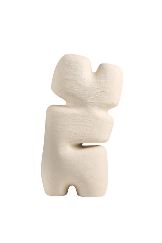 Beige block sculpture at an angle, showing the stepped profile from the side
