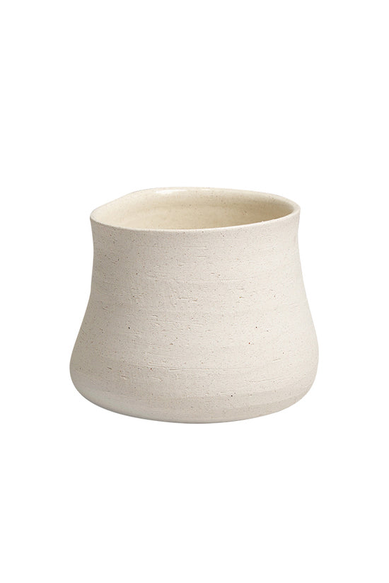 Sandface pinched form pot seen straight on, showing the waisted shape and sandy texture