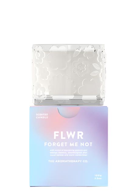The FLWR Forget Me Not candle standing on its blue gradient gift box, shown on white