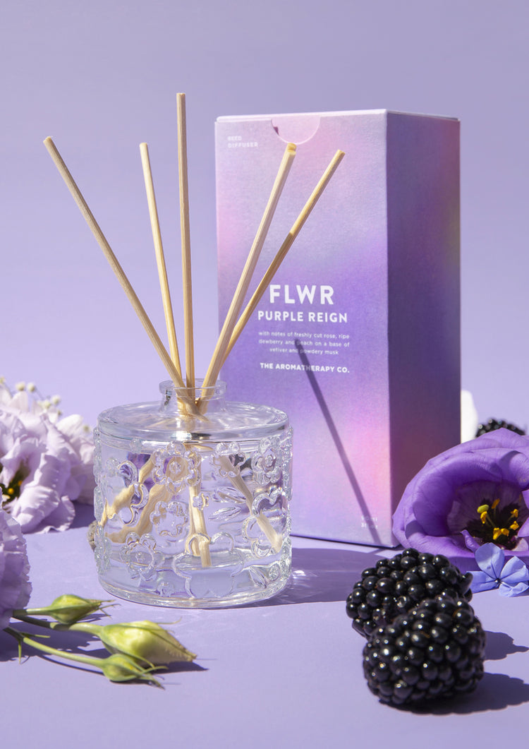 The Purple Reign diffuser with its purple carton, purple lisianthus and a ripe blackberry