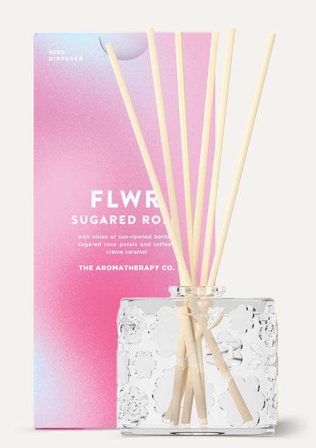 The Sugared Rose diffuser beside its pink gradient FLWR carton, shown on white