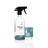 Good Change bathroom reusable spray bottle in glass.
