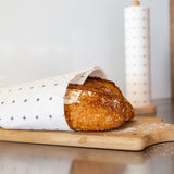 Bamboo towel roll styled on a kitchen bench in a modern home