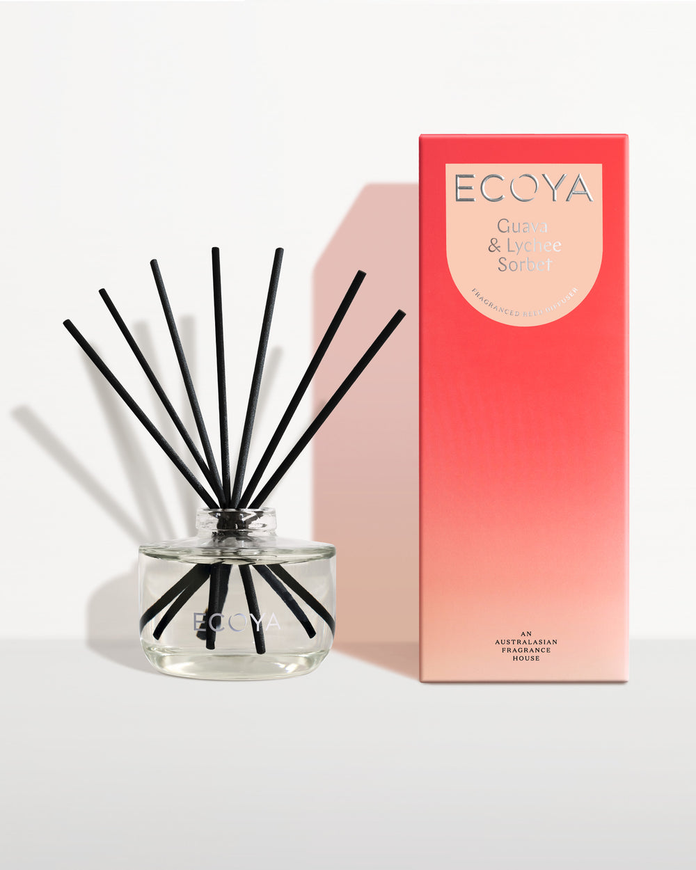 Ecoya Guava and Lychee Sorbet reed diffuser beside its red gift box