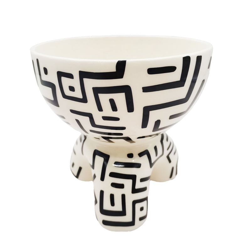 A 17.5 X 16 X 16.5CM Deco Pot with black and white designs on it by Flux Home.