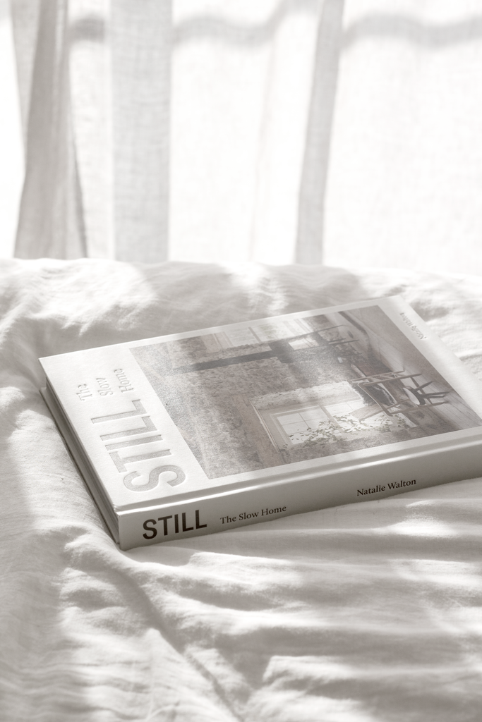 Still The Slow Home book styled on a shelf