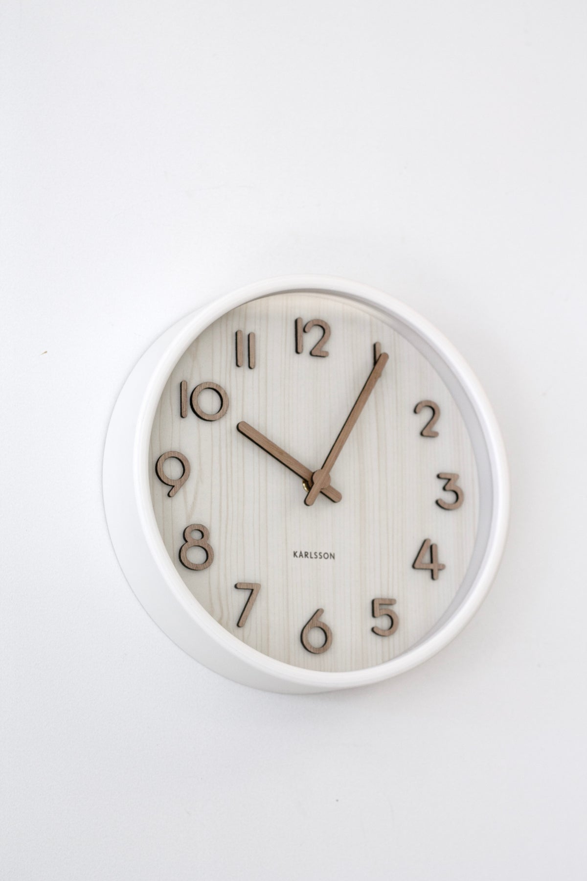 Karlsson Pure Wood Grain Wall Clock, close detail of the basswood grain