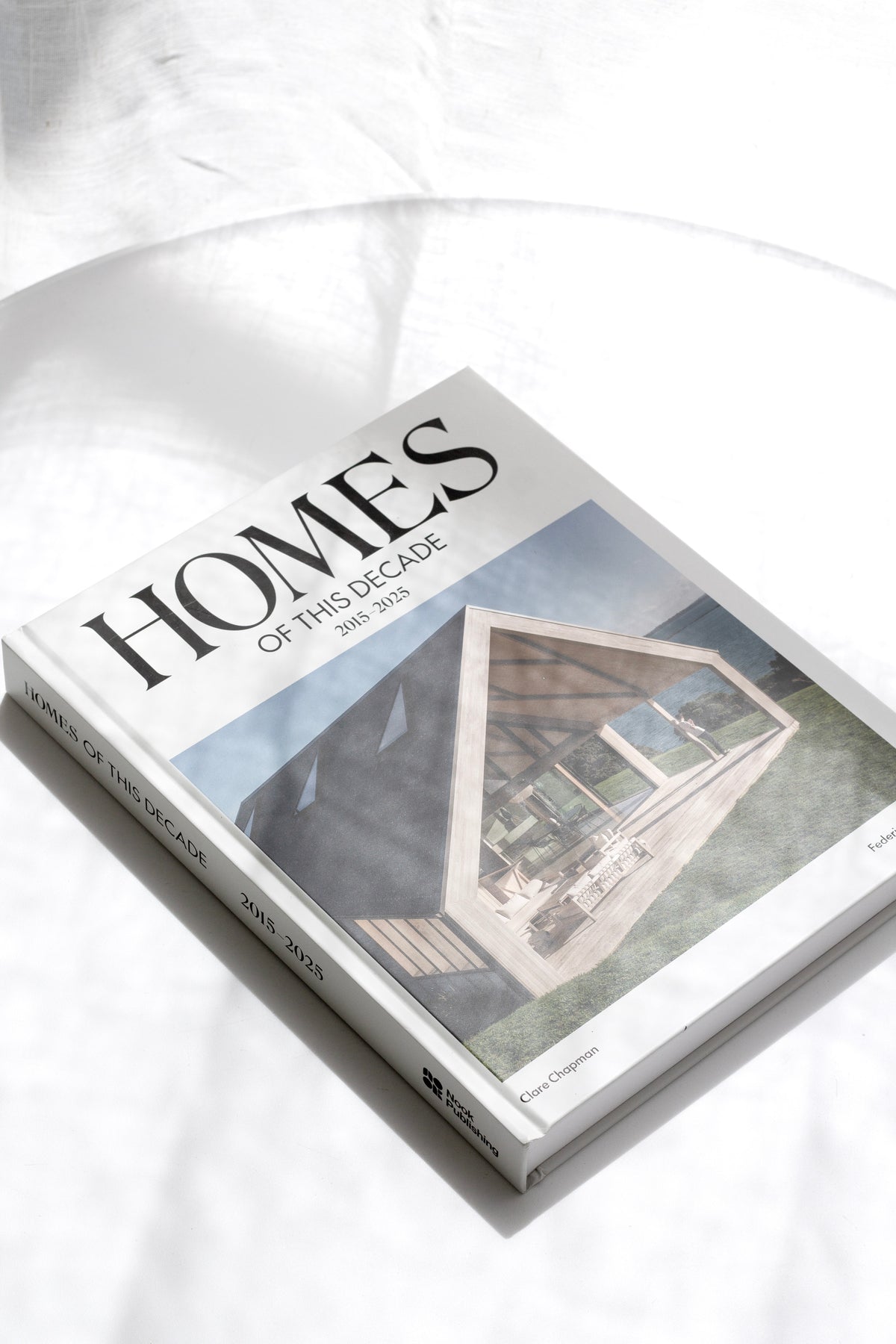 Homes of This Decade page spread showing a remote home