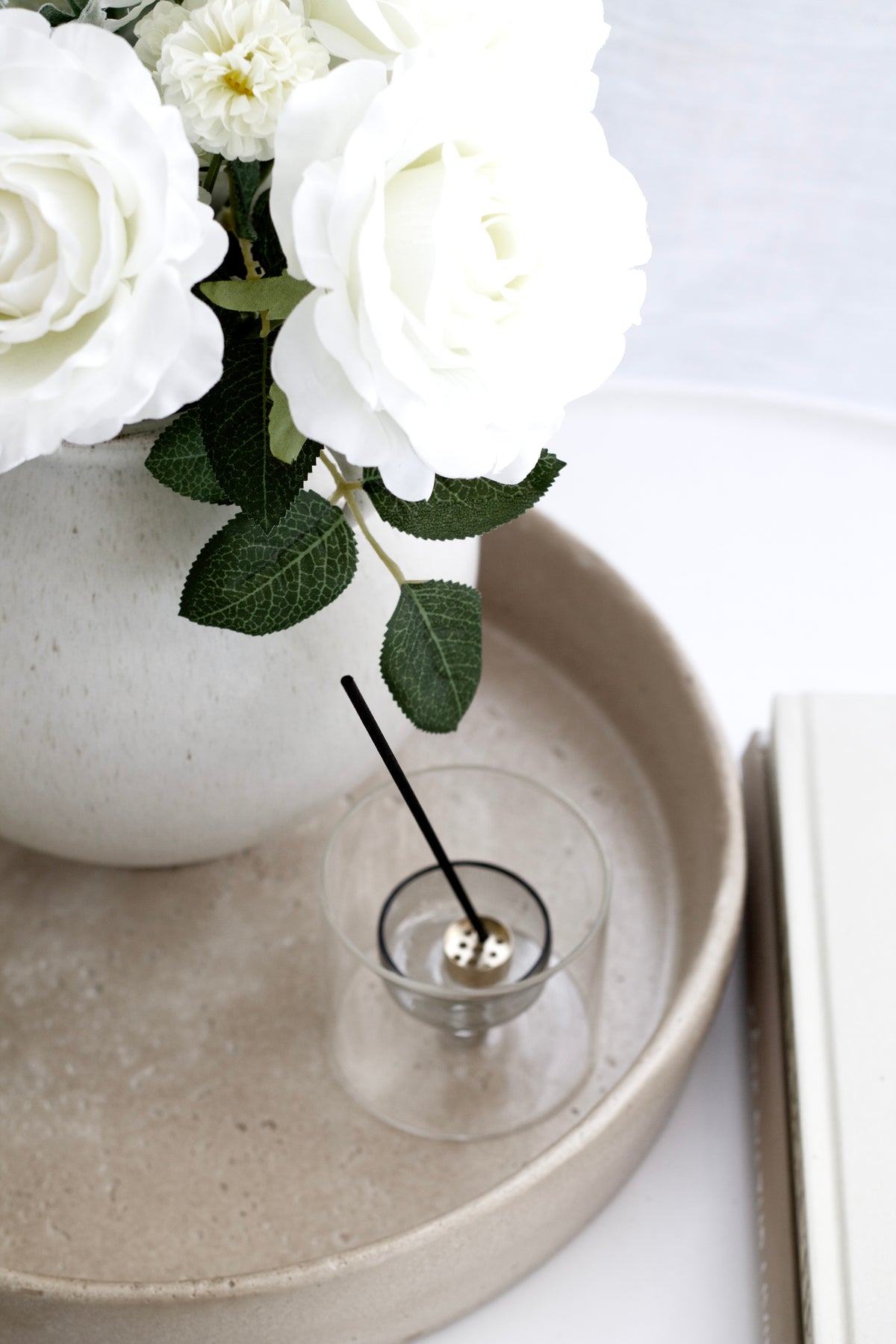 Sahara tray with a candle and white roses on a shelf