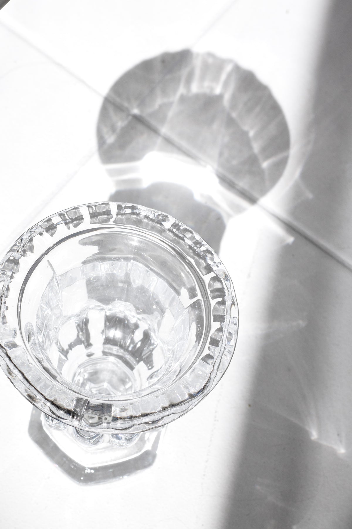 Omari clear glass urn vase seen from above on a bright white surface