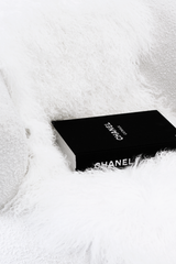 Books CHANEL CATWALK: THE COMPLETE COLLECTIONS on a white fur rug - featuring Karl Lagerfeld and Chanel Catwalk.