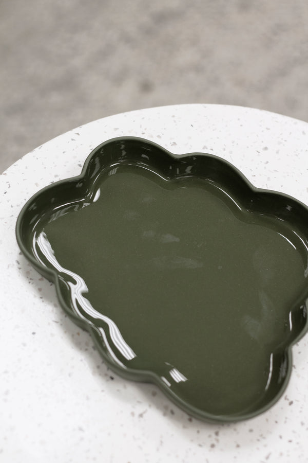 A Ned Collections Cloud Jewellery Tray, a green serving tray organic piece, perfect for easy displaying on a white table.
