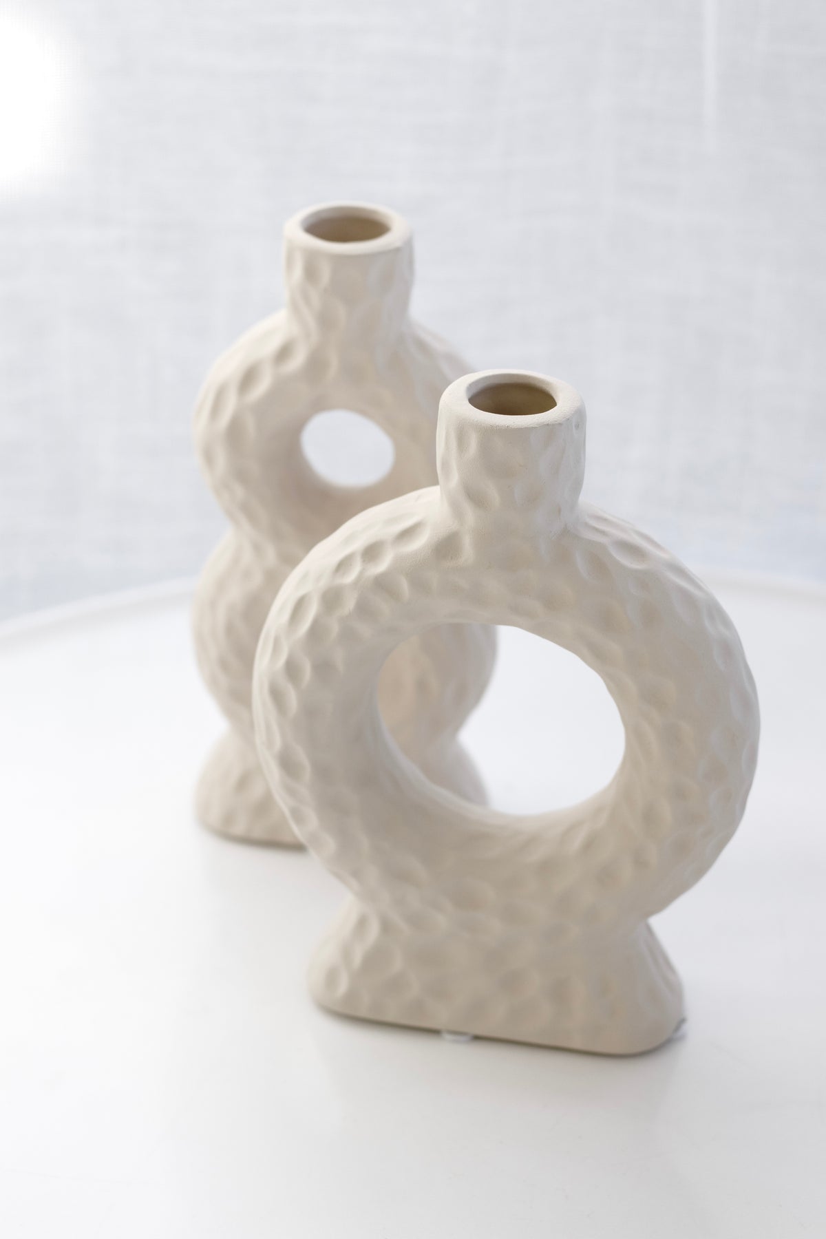 Naples Loop Ceramic Vase in front with the Sicily figure-of-eight vase behind
